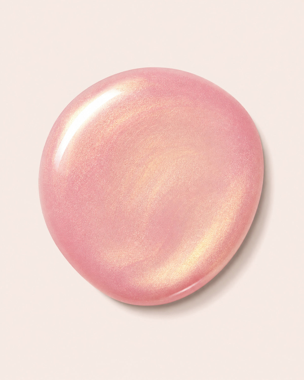 Pink shimmery nail polish cap, glossy round top