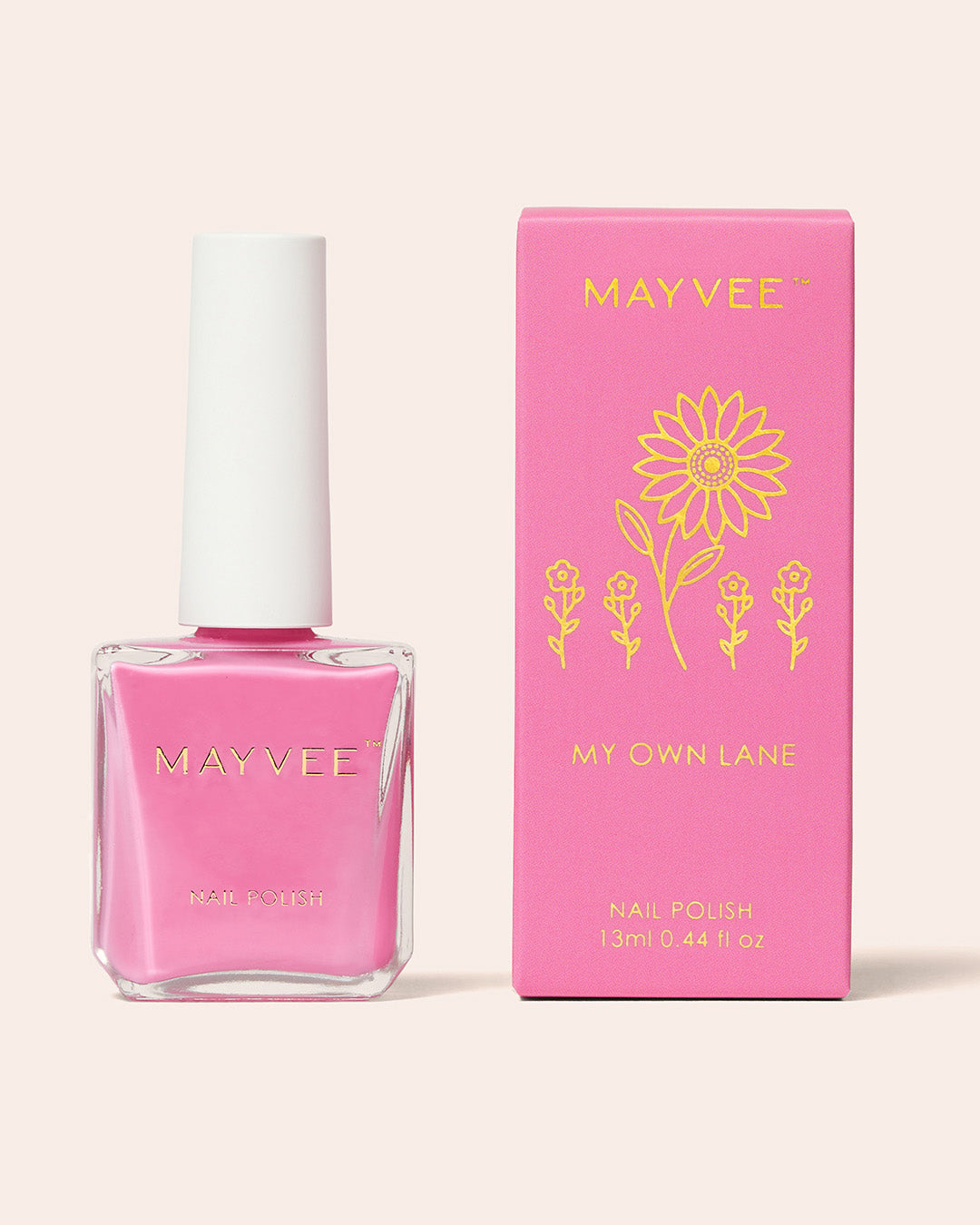 Pink nail polish bottle with matching box, floral label