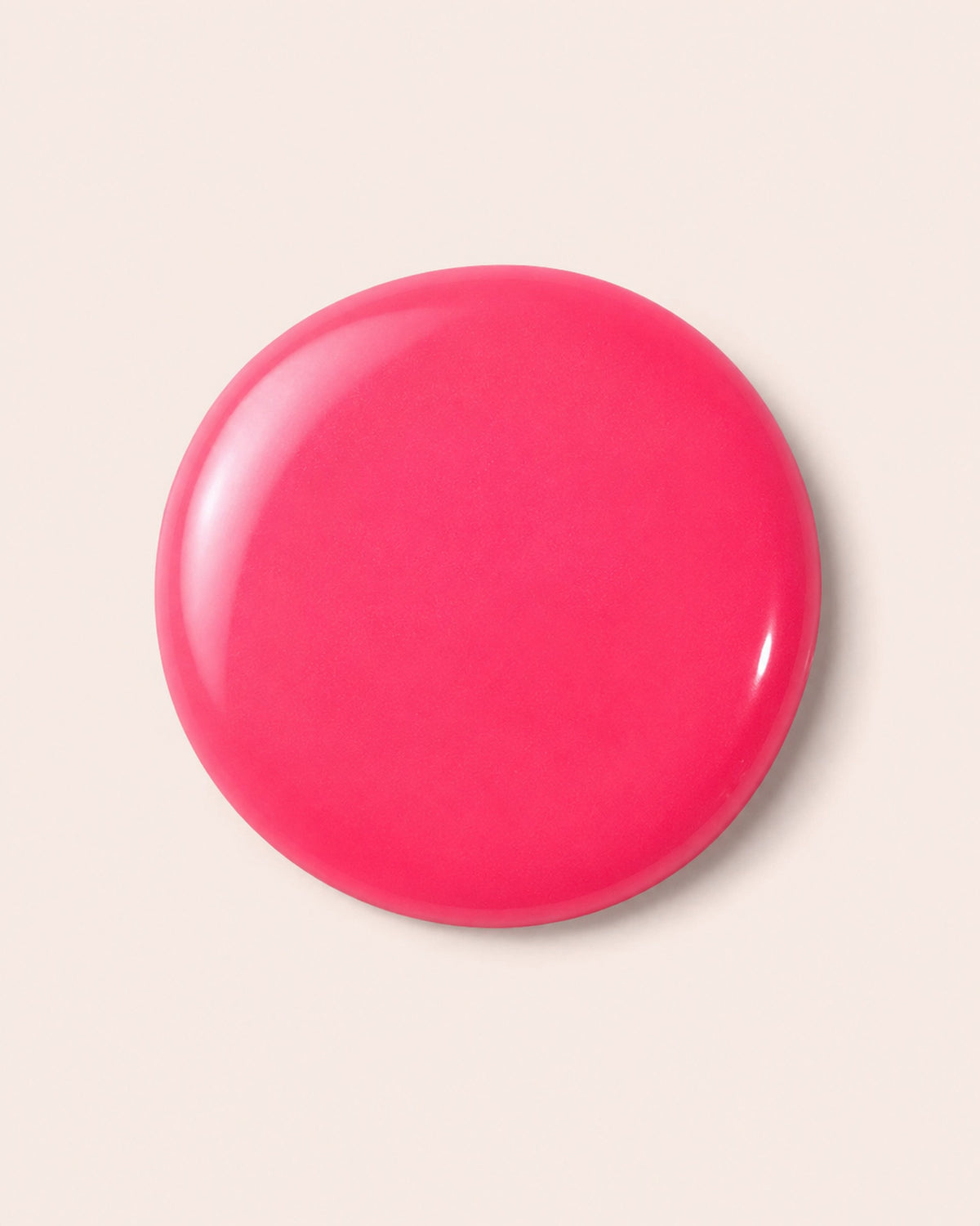 Fuchsia nail polish swirl cap top, glossy circular surface