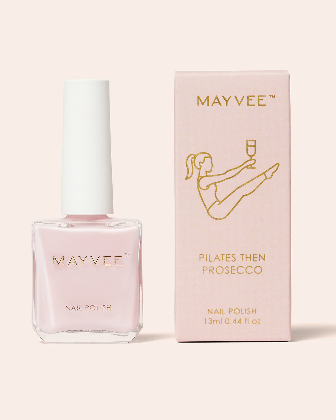 Pink nail polish bottle with MAYVEE “Pilates Then Prosecco” box