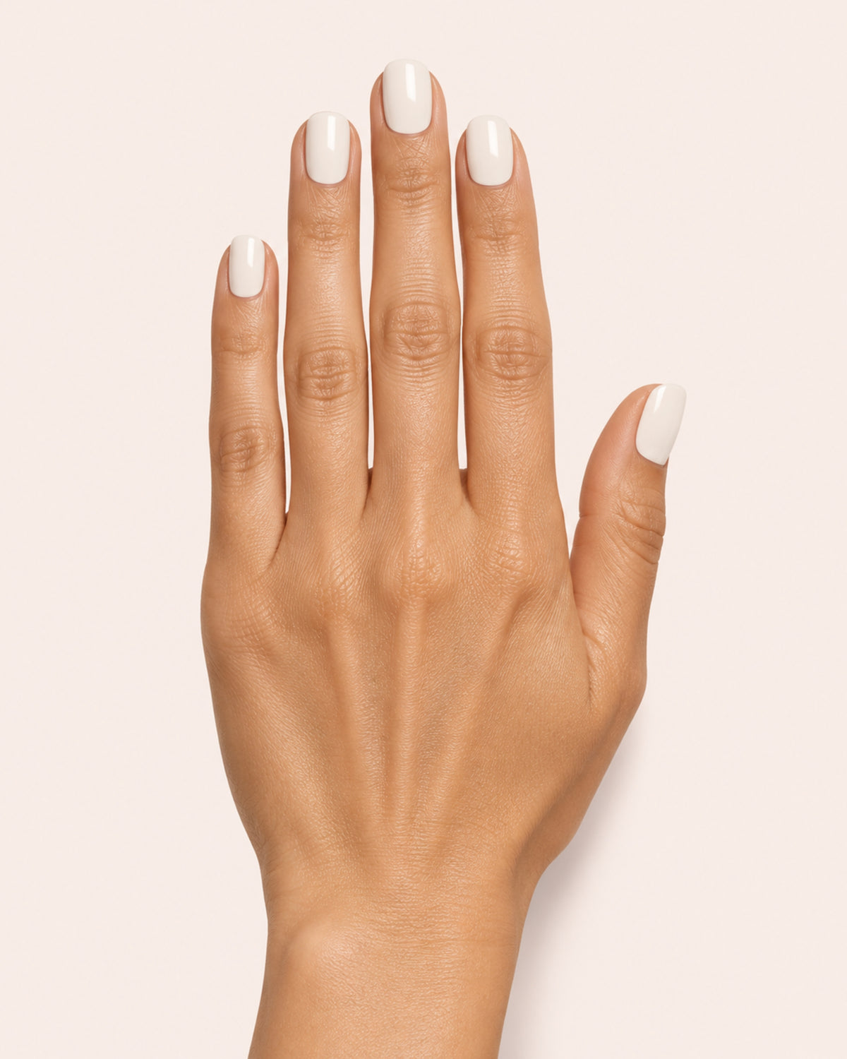 Mayvee nail polish in 'Oat Milk Oracle' eggshell white creme nail colour on medium skin tone
