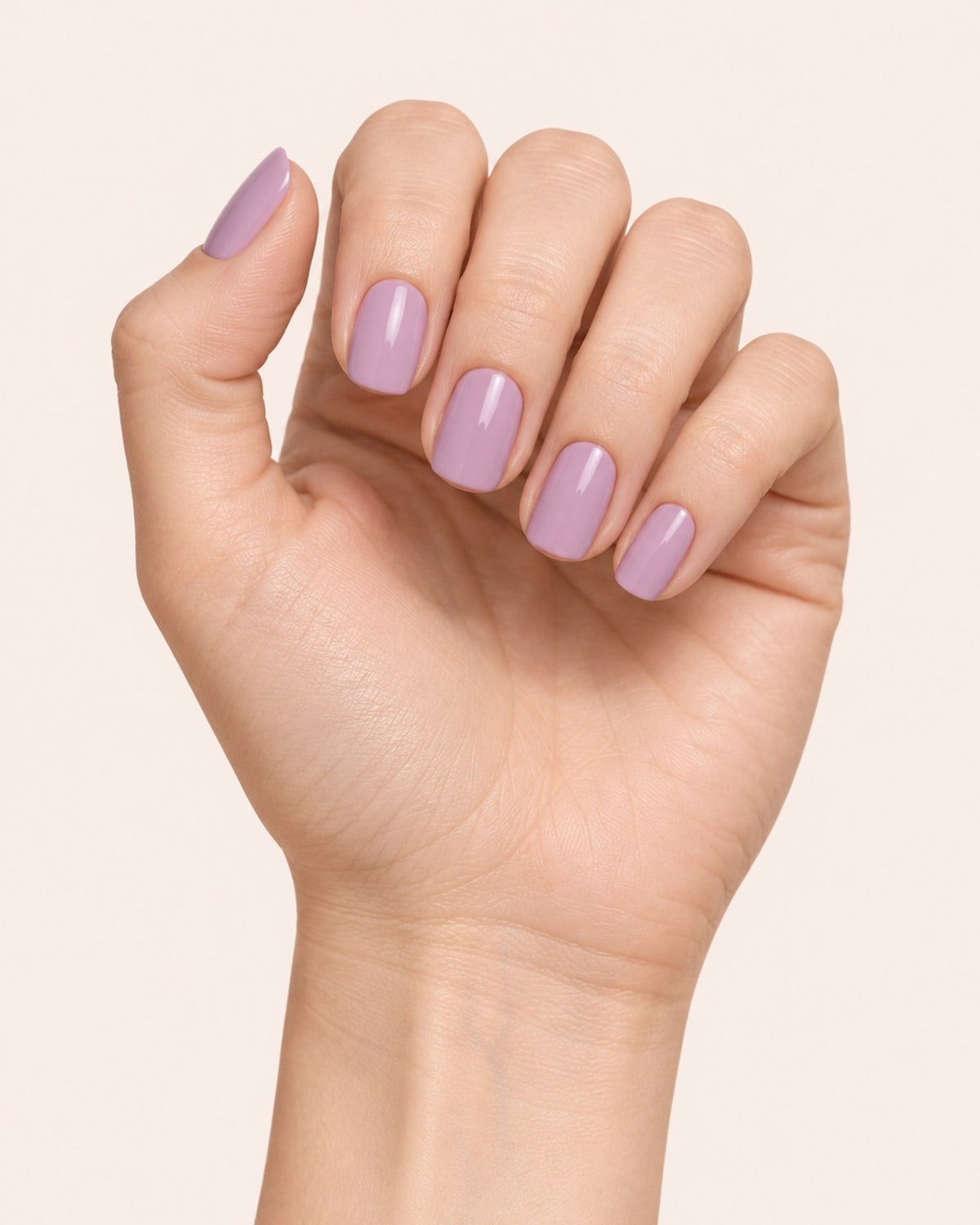Mayvee nail polish in 'Worth The Detour' purple creme nail colour on light skin tone