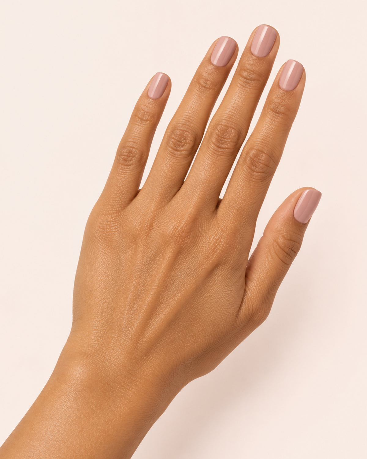 Mayvee nail polish in 'Barely Balanced' soft pink creme nail colour on olive skin tone hand