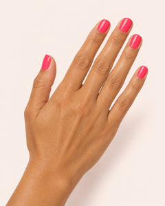 Mayvee nail polish in 'Born Like This' fluro pink creme nail colour on olive skin tone