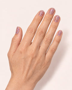Mayvee nail polish in 'Cancel My Plans' pink holographic glitter nail colour on fair skin tone