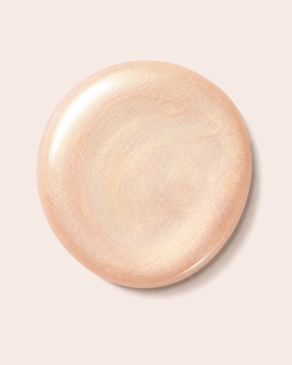 Shimmer peach-gold nail polish swatch, round top view