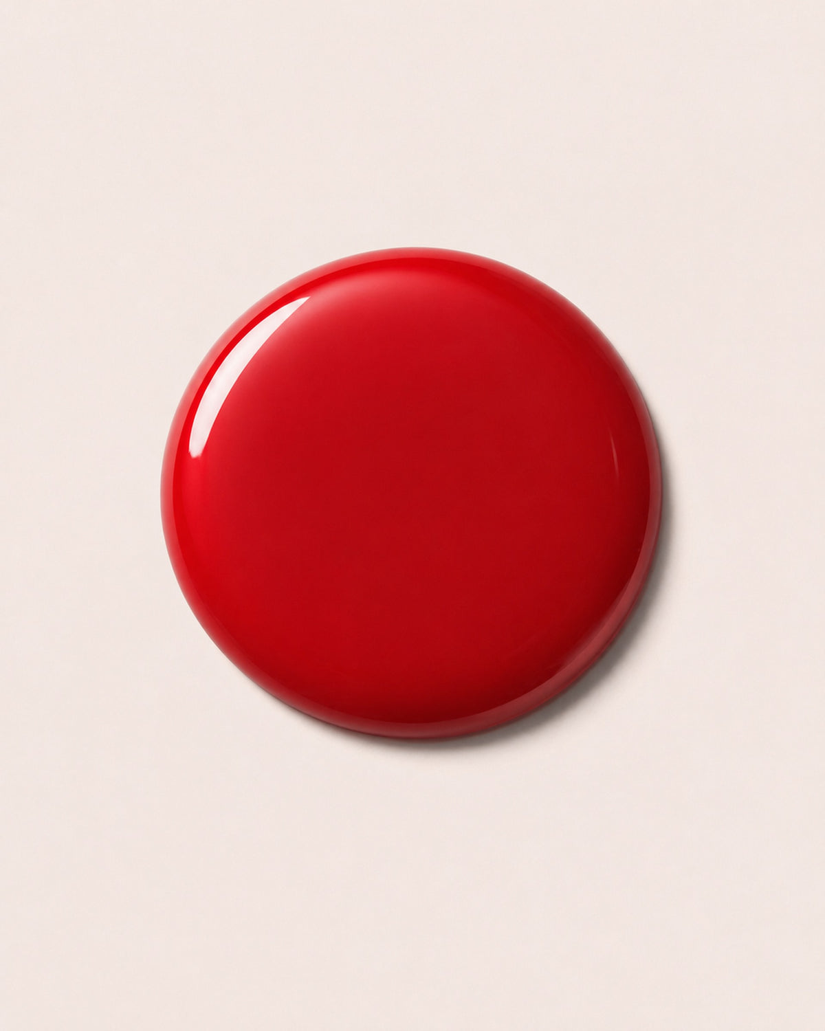 Red nail polish cap with glossy finish
