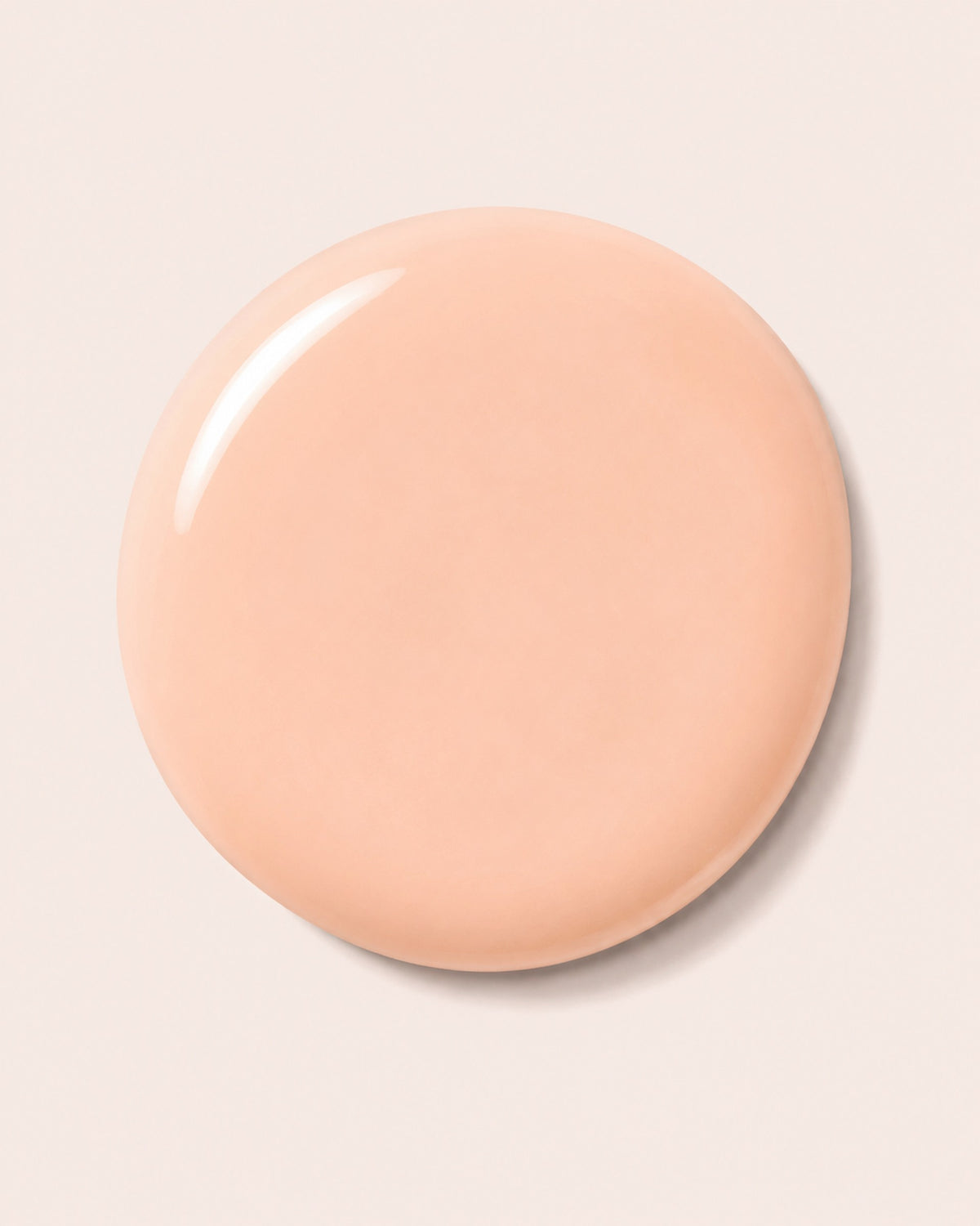 Peach nail polish cap with glossy finish