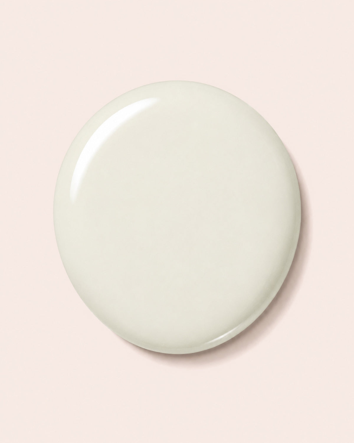 Creamy white nail polish swatch, glossy round surface