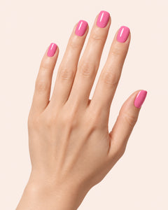 Mayvee nail polish in 'My Own Lane' bright pink creme nail colour on fair skin tone