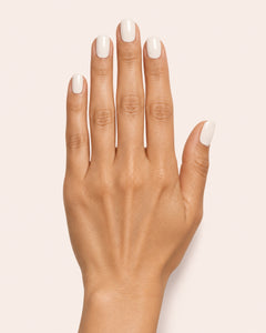 Mayvee nail polish in 'Oat Milk Oracle' eggshell white creme nail colour on medium skin tone