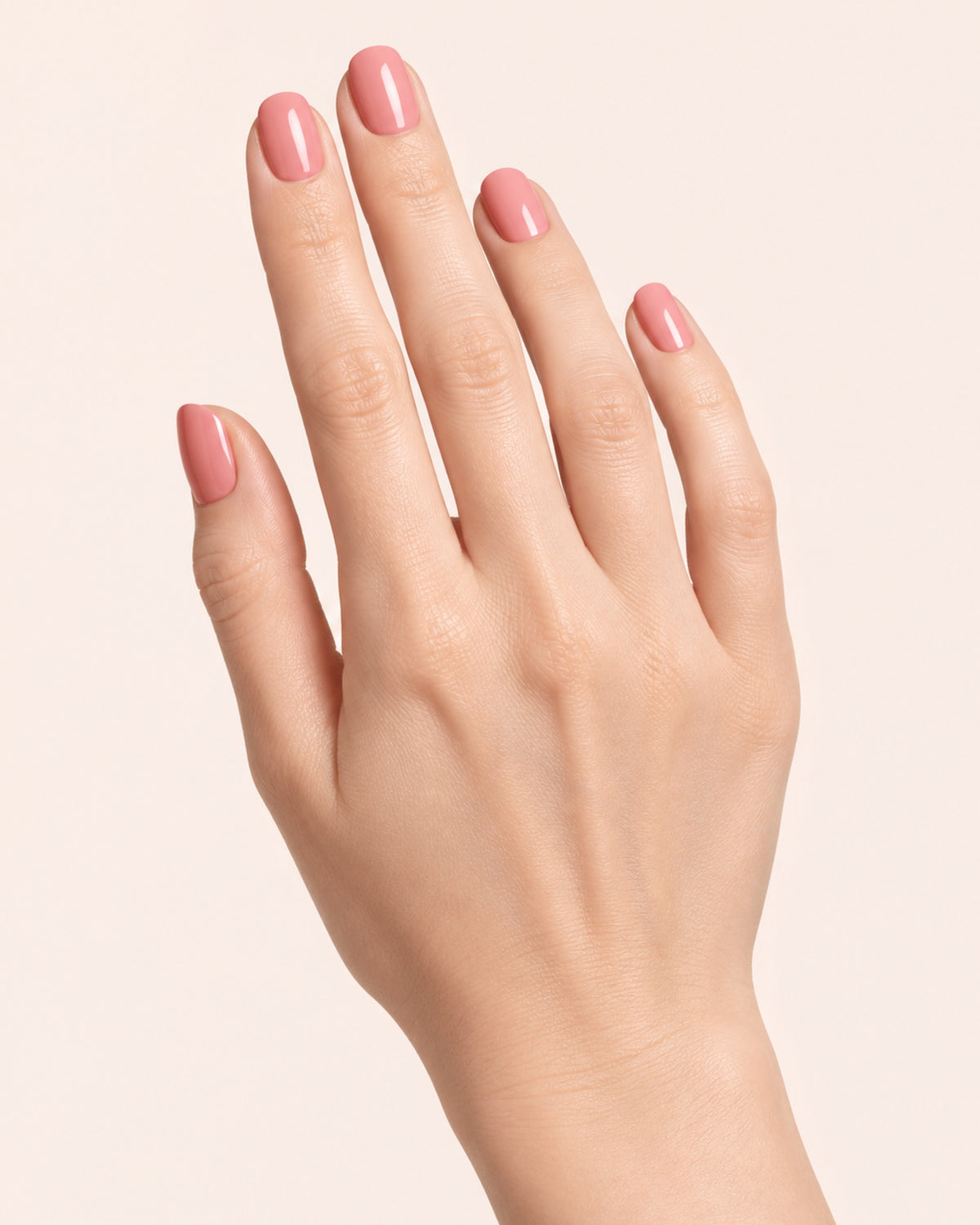 Mayvee nail polish in 'Too Pretty To Rush' pink creme nail colour on fair skin tone
