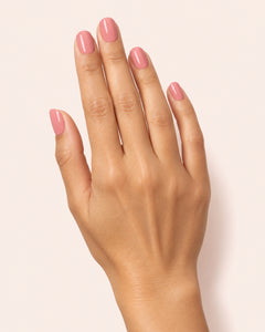 Mayvee nail polish in 'Too Pretty To Rush' pink creme nail colour on olive skin tone