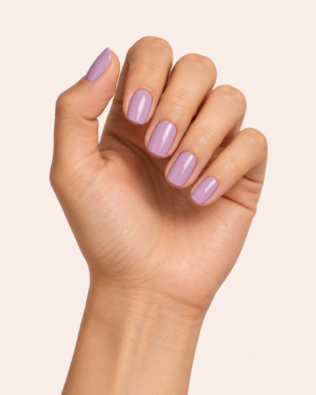 Mayvee nail polish in 'Worth The Detour' purple creme nail colour on olive skin tone