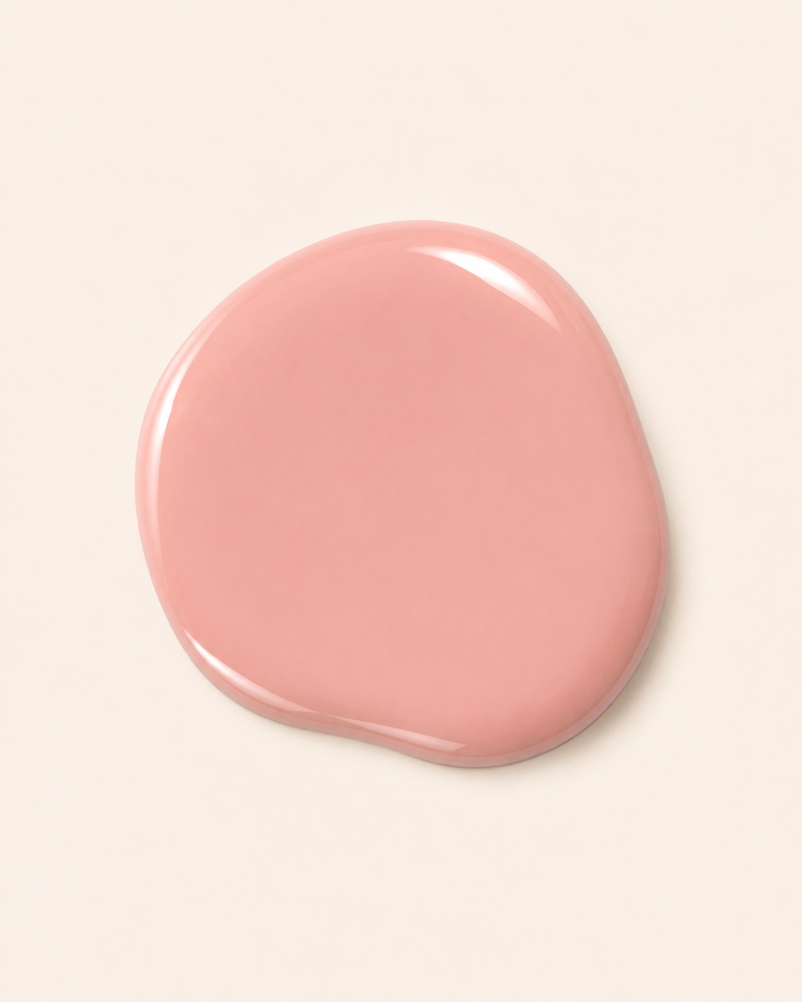 A glossy, irregular-shaped smear of dusty pink nail polish on a solid off-white background.